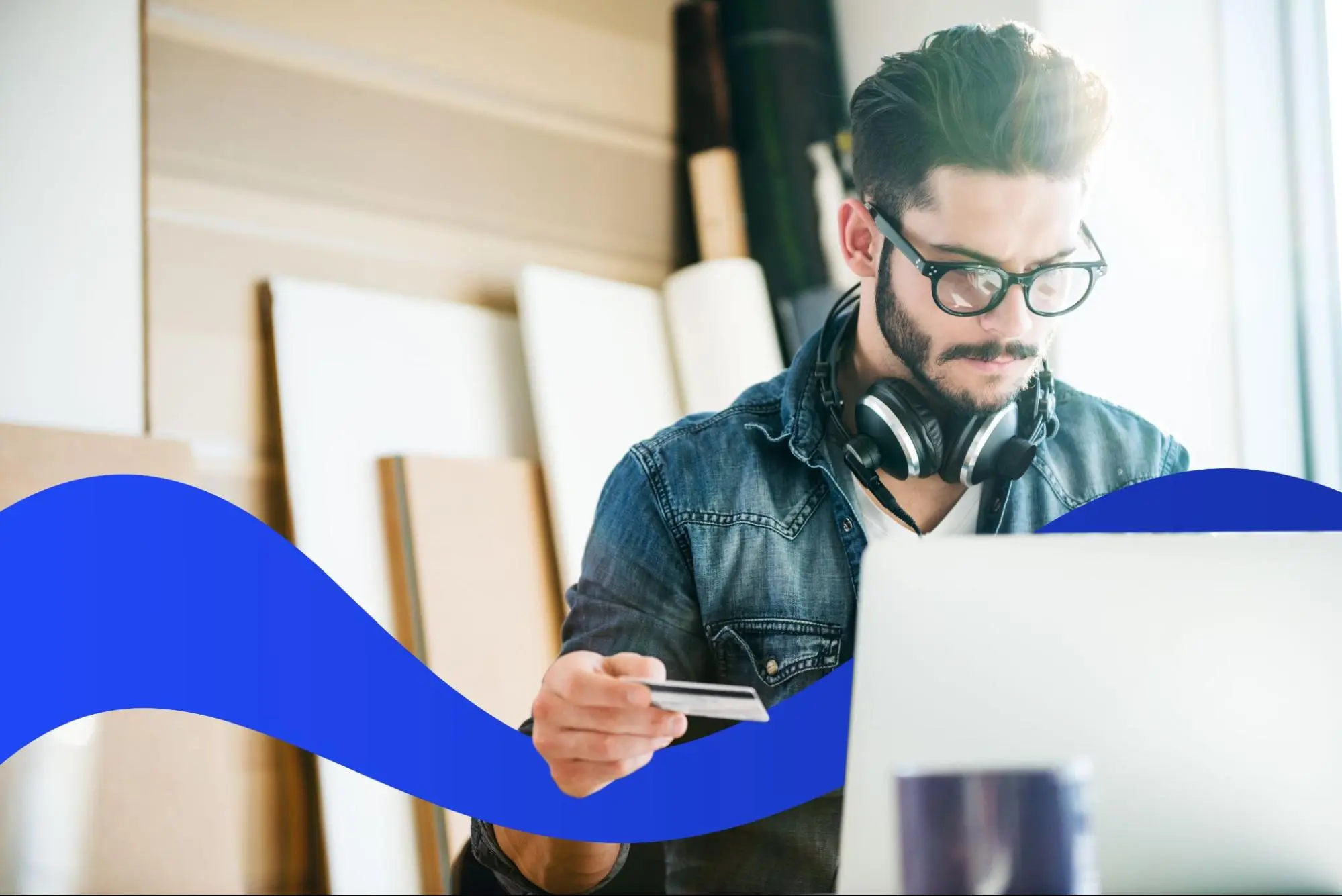 Man sitting in front of a computer working on expense reimbursements