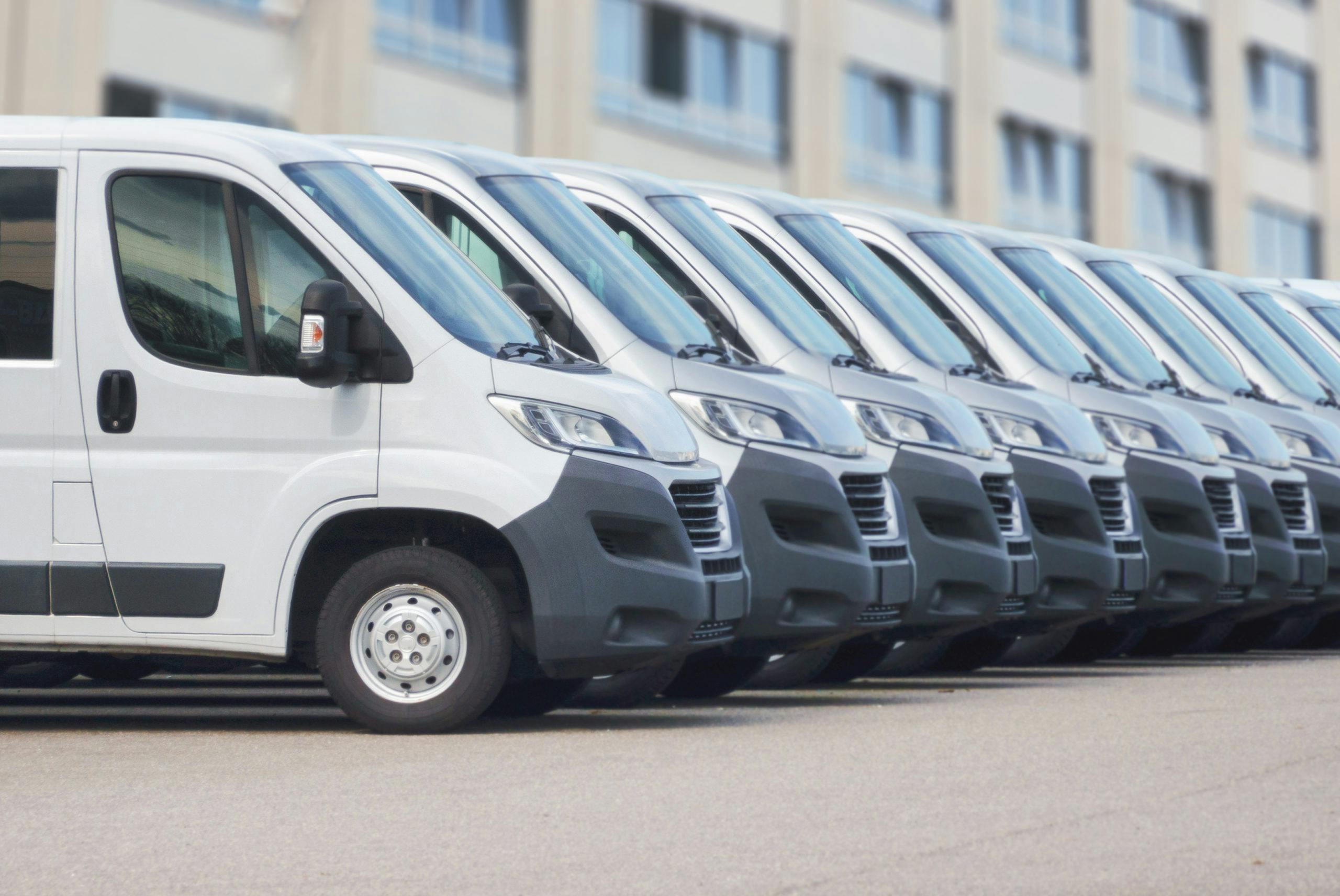 White delivery vans in a row