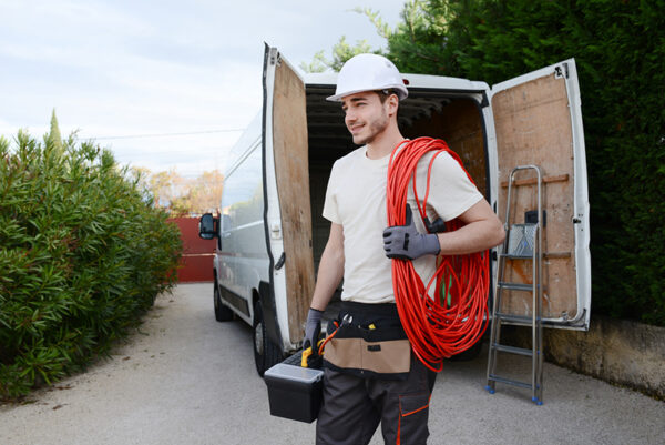 Man taking tools from his work vans