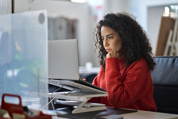 woman on computer to apply for fuel card 