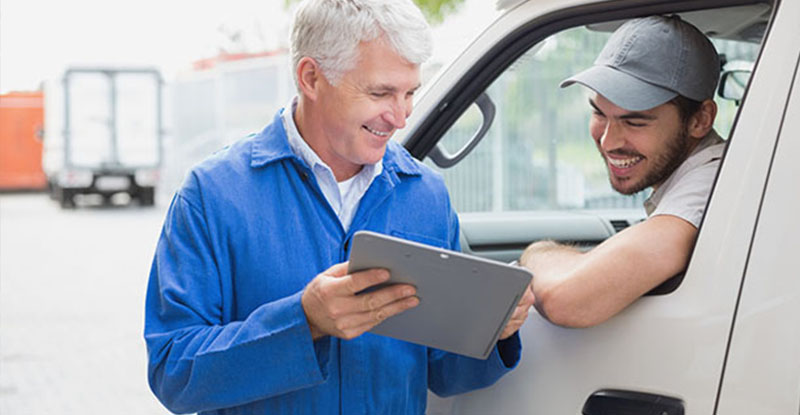 Man taking info for fleet management cost analysis