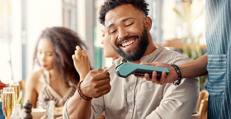 Man using his card for incidental expenses